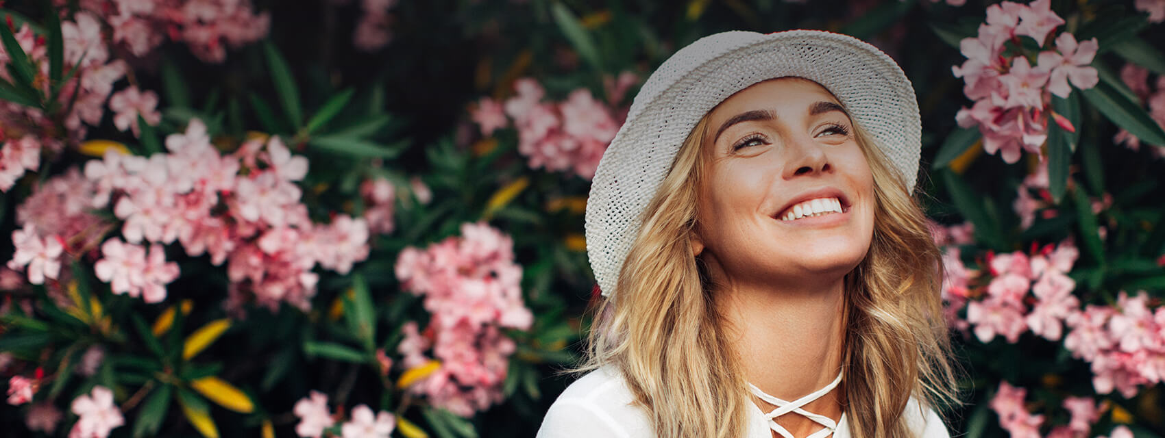 woman wearing a hat smiling