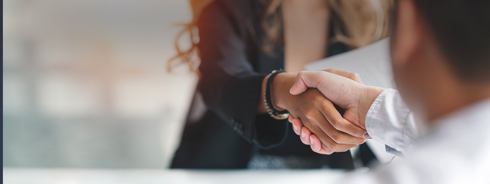 man and woman shaking hands