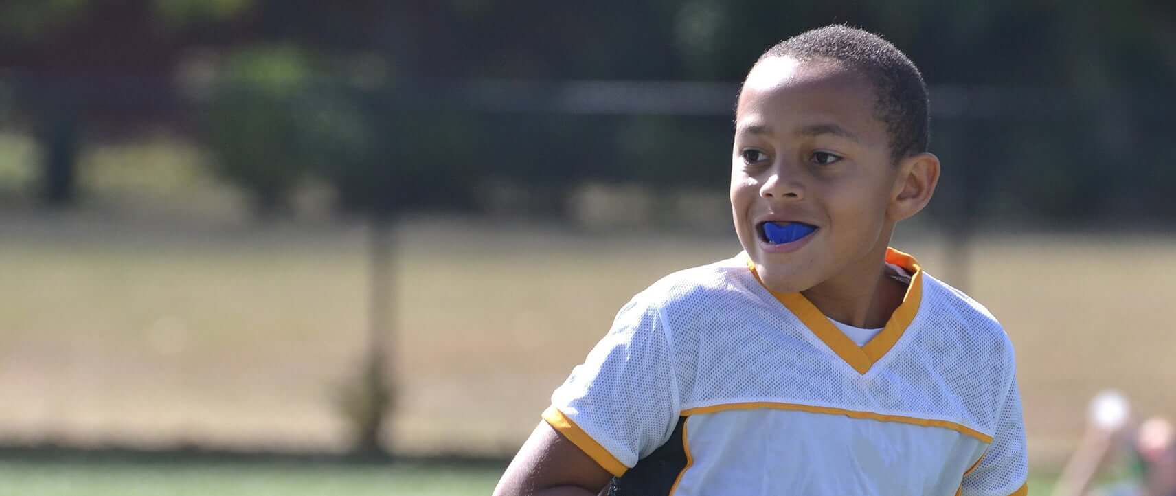 young boy playing sports