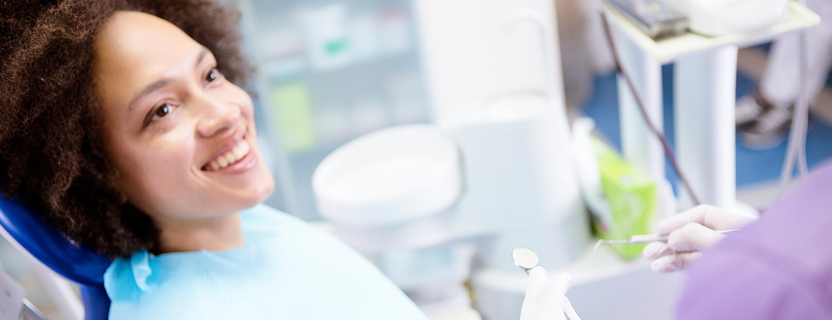 smiling woman sitting in a dental chair